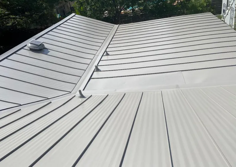 Solar attic fan installed on a metal roof for Roof Ventilation in Garnet